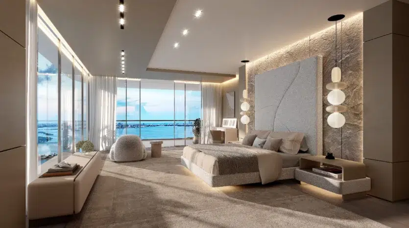 Dormitorio con una cama grande, luces modernas y balcón con vistas al mar