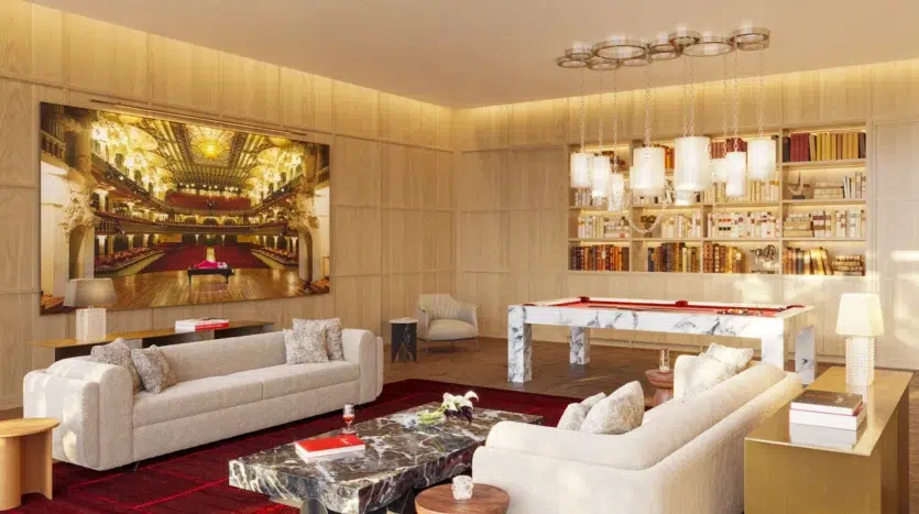 Salón de billar de lujo con sofás y televisor grande