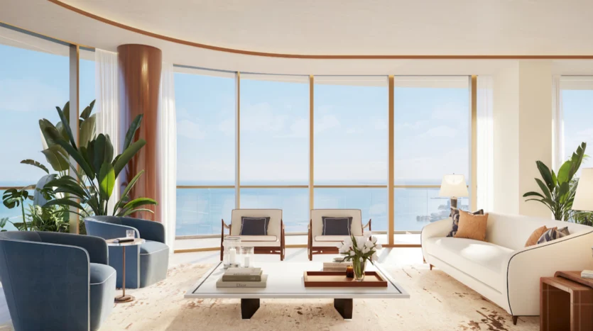 Sala de estar moderna con decoración dorada y vistas al mar
