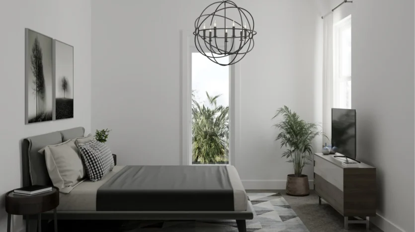 Dormitorio con una cama y televisor