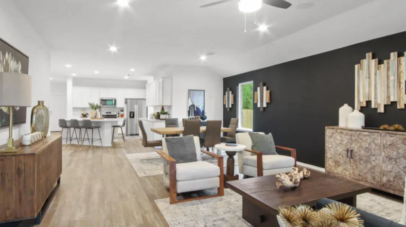 Sala de estar moderna junto a la cocina y comedor