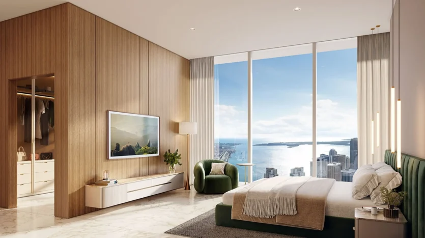 Dormitorio de lujo con televisor y vestidor interior