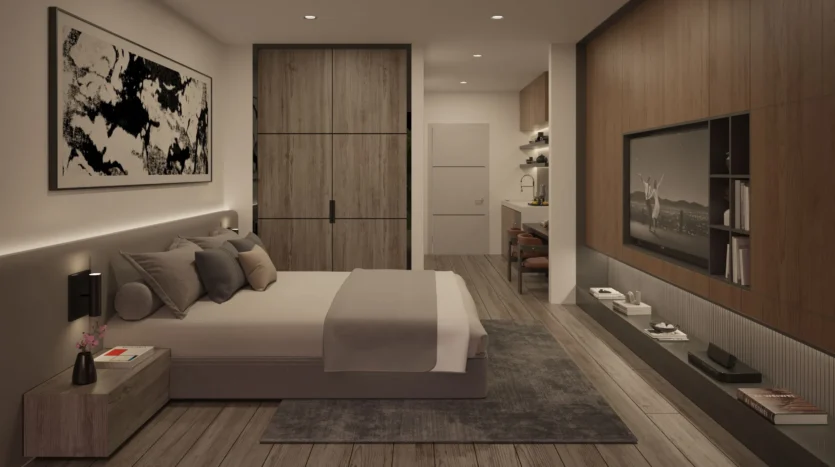 Dormitorio de una cama con televisión y gran armario