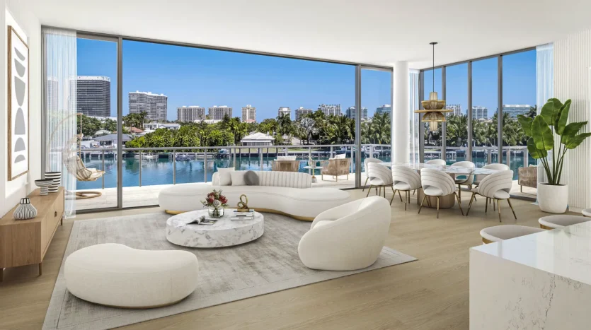 Sala de condo con muebles modernos y balcón con vistas a la alberca