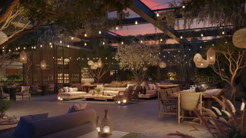 Jardín en la terraza con iluminación cálida y muebles modernos