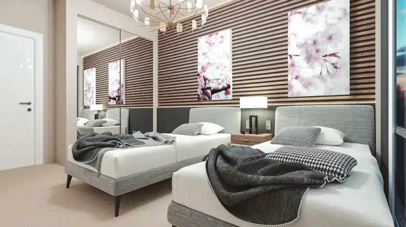 Dormitorio de dos cama y espejo